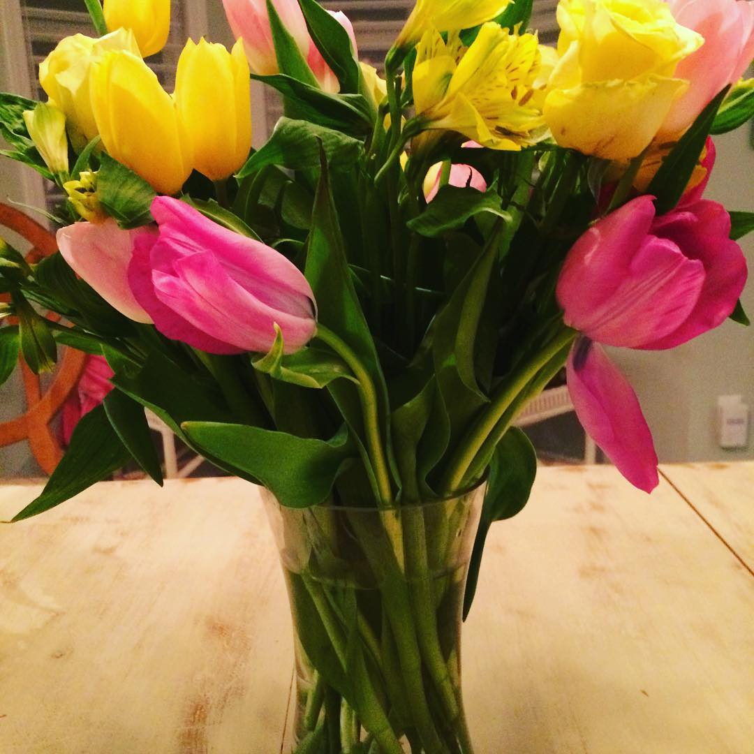 Cooking Easter dinner for 16, in a rented beach house meant no time for a fancy table-setting or pretty flowers. Which is okay because the most important thing is having loved ones around the table. But then a guest brought these beautiful spring flowers, which I love!