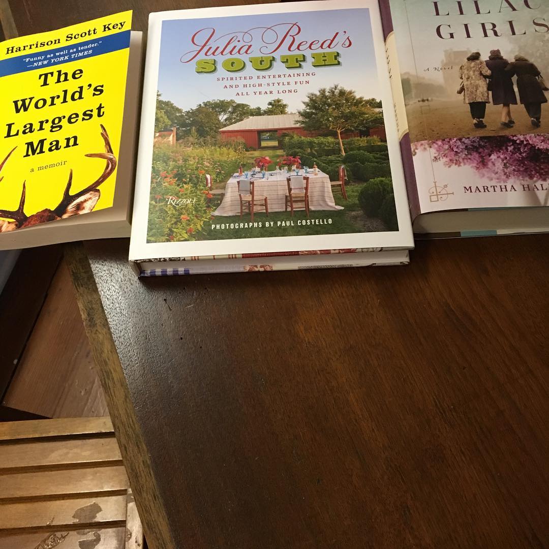 First day of tour and I'm already loading up on books. Can't wait to crack open @juliaevansreed new cookbook and The Lilac Girls and The World's Largest Man by @harrisonscottkey