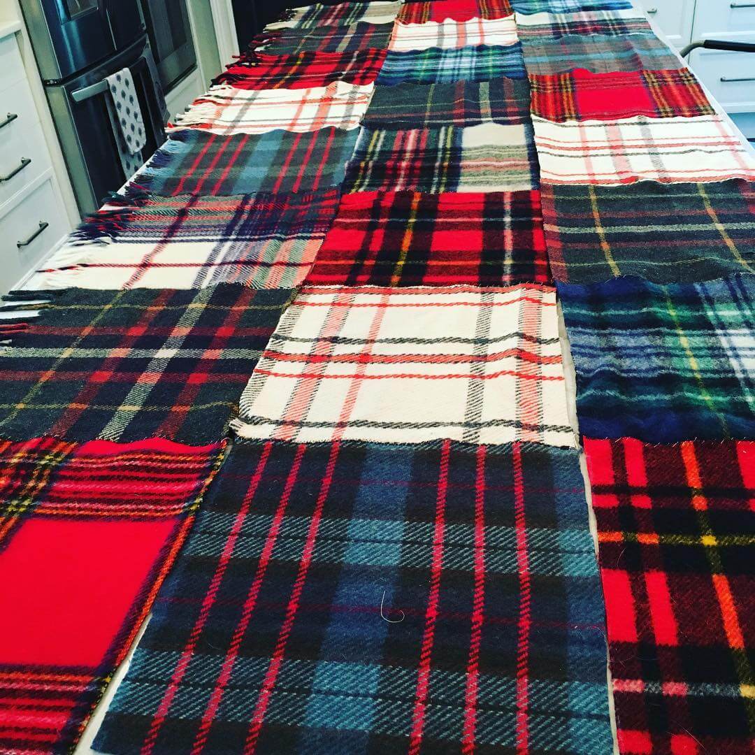 I needed a project to keep my hands busy...did I mention our house is on our neighborhood Christmas home tour???
I decided to cut up some of my moth-eaten stadium blankets to make a table-topper for my foyer table