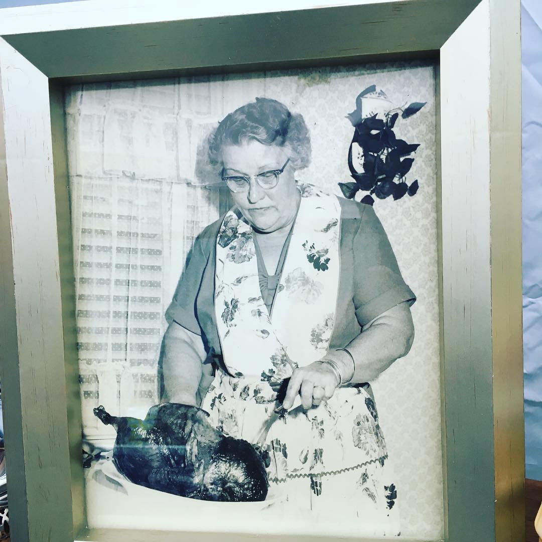 Framed photo of somebody's mamaw with a burnt turkey