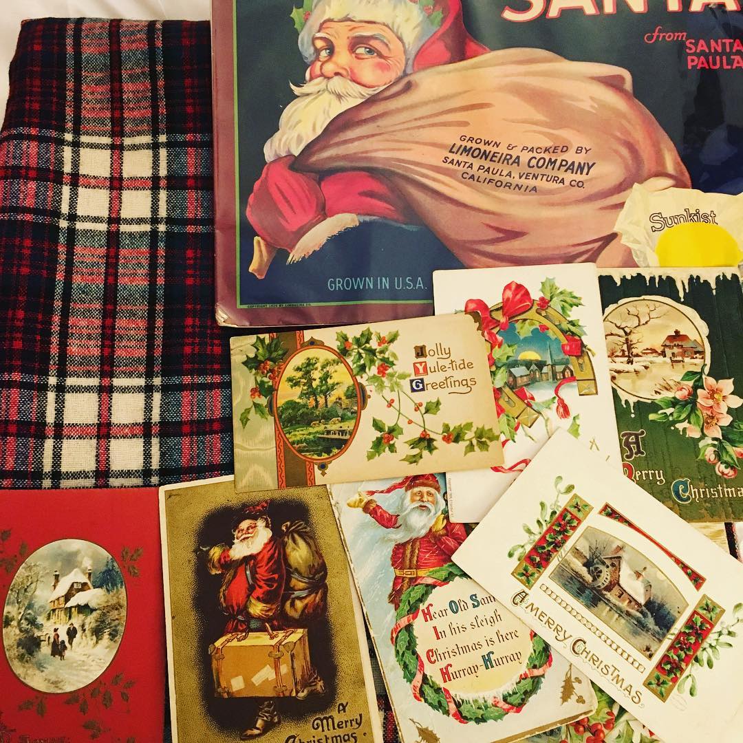 My junk haul from @ChelseaFleaMarket-- wool plaid yardage, vintage cardboard fruit crate label and vintage Christmas postcards. All destined for my